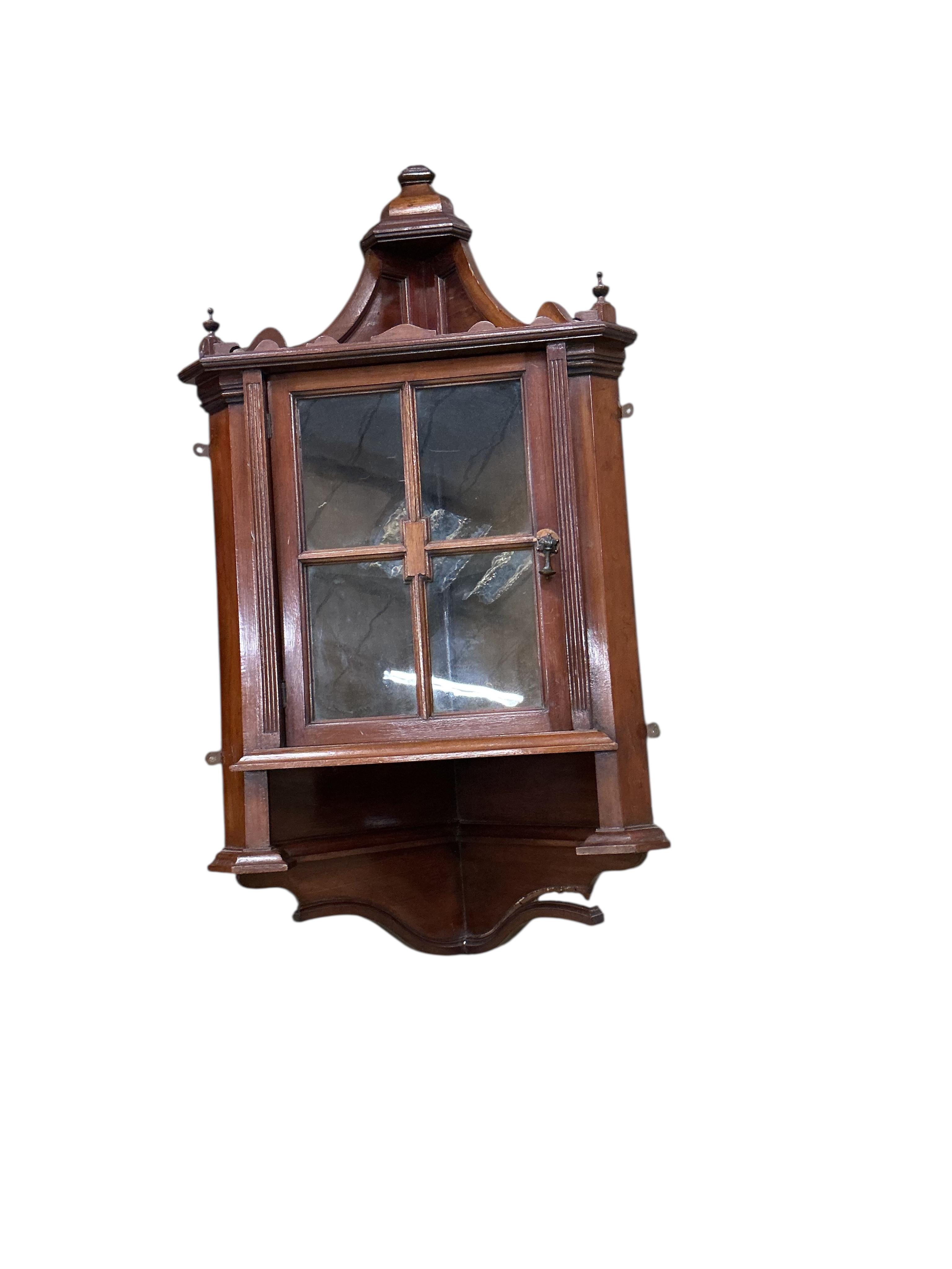 A pair of small late Victorian mahogany hanging corner cabinets, width 48cm, depth 26cm, height 96cm